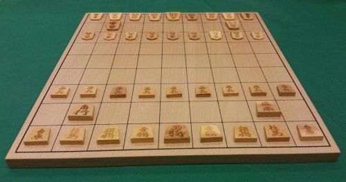 Small wooden shogi pieces